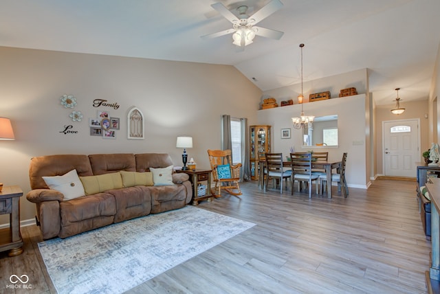 741 Chestnut Ln, Brownsburg, IN 46112 - living room featuring ceiling fan, a chandelier, light wood finished floors, and high vaulted ceiling