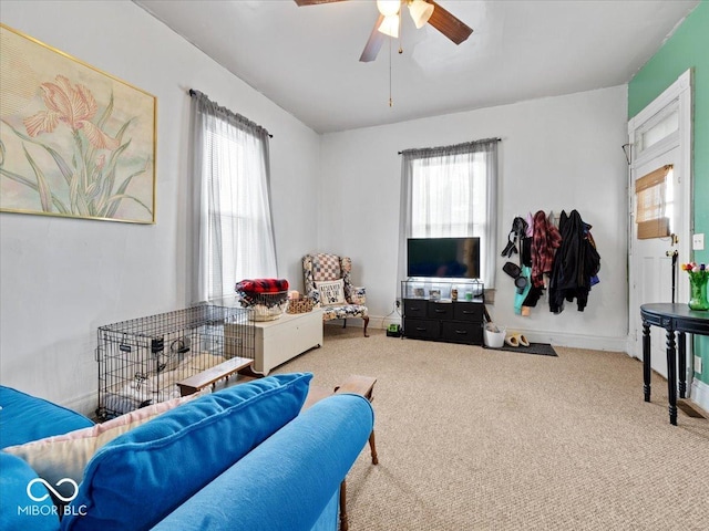 215 N E St, Greensburg, IN 47240 - carpeted living area with healthy amount of natural light and ceiling fan