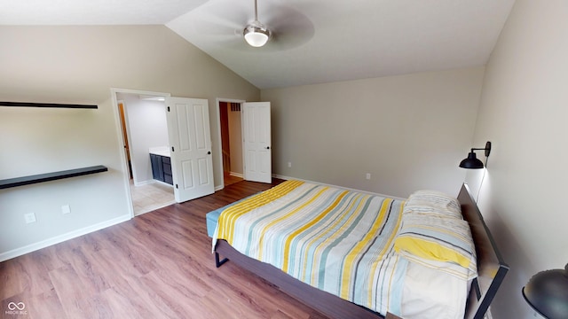 9831 Deering St, Fishers, IN 46037 - bedroom with vaulted ceiling, wood finished floors, ceiling fan, and ensuite bath