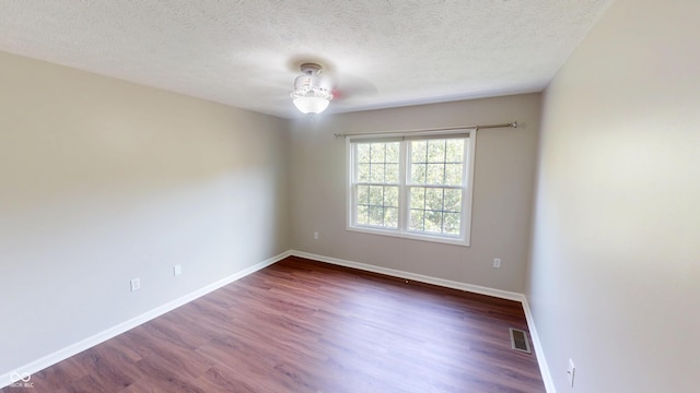 9831 Deering St, Fishers, IN 46037 - unfurnished room featuring dark wood-style floors, a textured ceiling, and ceiling fan