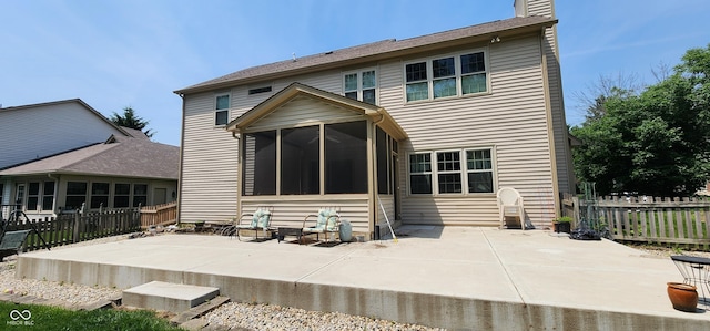 9831 Deering St, Fishers, IN 46037 - back of property featuring a patio, a fenced backyard, a chimney, and a sunroom