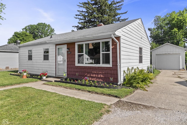 206 Allen Ln, Greenfield, IN 46140 - view of front facade with an outbuilding, concrete driveway, a garage, a front lawn, and roof with shingles