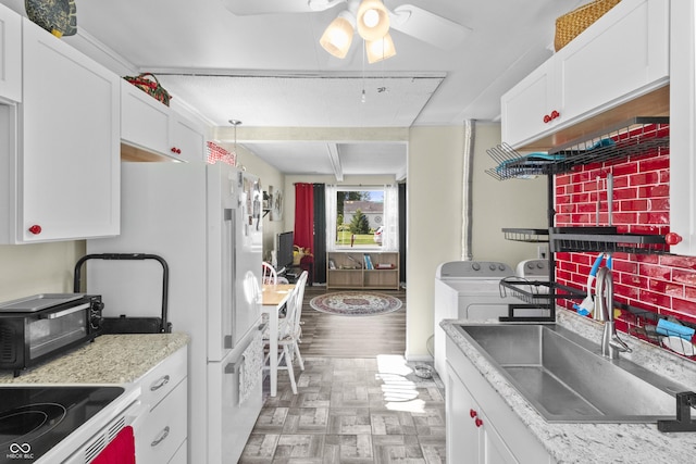 206 Allen Ln, Greenfield, IN 46140 - kitchen featuring washer and clothes dryer, white cabinetry, ceiling fan, light countertops, and freestanding refrigerator