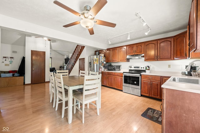 155 Hoover Dr, Princes Lakes, IN 46164 - kitchen with appliances with stainless steel finishes, under cabinet range hood, ceiling fan, light wood-style flooring, and light countertops