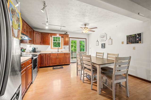 155 Hoover Dr, Princes Lakes, IN 46164 - kitchen with appliances with stainless steel finishes, under cabinet range hood, light wood-style flooring, and ceiling fan