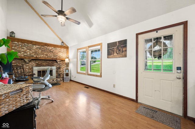 155 Hoover Dr, Princes Lakes, IN 46164 - living room with a fireplace, ceiling fan, plenty of natural light, light wood finished floors, and lofted ceiling