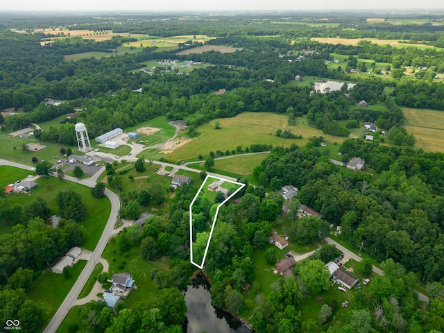 155 Hoover Dr, Princes Lakes, IN 46164 - aerial view of sparsely populated area with property boundaries highlighted and a large body of water