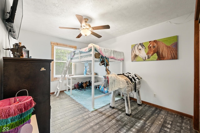 155 Hoover Dr, Princes Lakes, IN 46164 - bedroom with a textured ceiling, a ceiling fan, and wood finished floors
