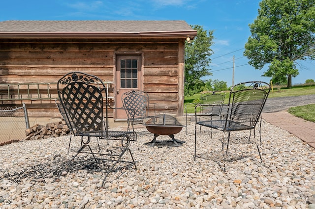 155 Hoover Dr, Princes Lakes, IN 46164 - view of patio featuring an outdoor fire pit