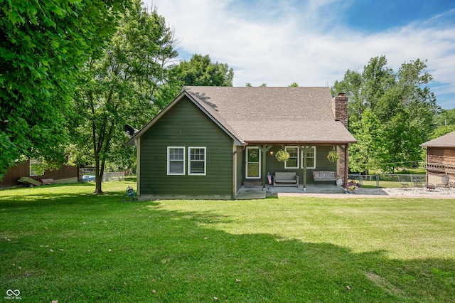 155 Hoover Dr, Princes Lakes, IN 46164 - view of front of home featuring a chimney, covered porch, and roof with shingles