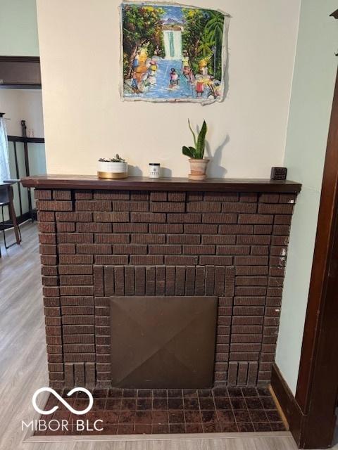 2830 Guilford Ave, Indianapolis, IN 46205 - detailed view of a brick fireplace and wood finished floors