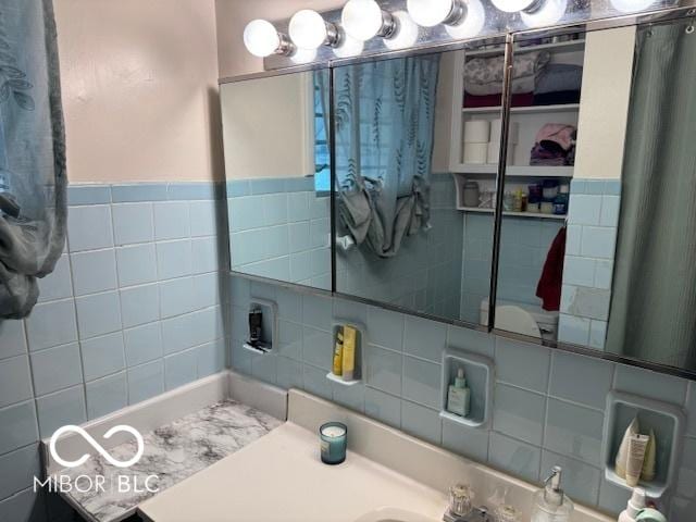 2830 Guilford Ave, Indianapolis, IN 46205 - bathroom featuring tile walls and vanity
