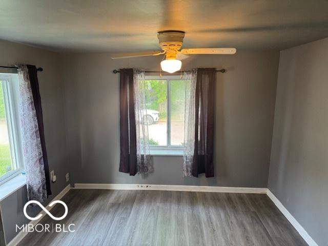 2830 Guilford Ave, Indianapolis, IN 46205 - unfurnished room featuring plenty of natural light, a ceiling fan, and wood finished floors