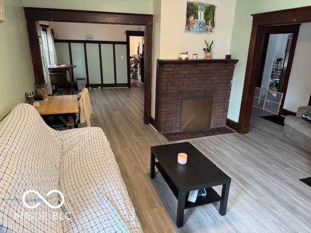 2830 Guilford Ave, Indianapolis, IN 46205 - living room featuring wood finished floors and a fireplace