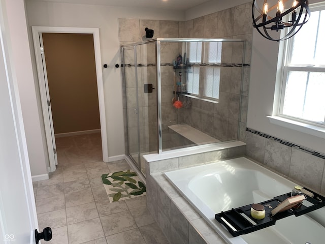 7270 W Stone Pass, New Palestine, IN 46163 - full bathroom with a stall shower, a garden tub, a chandelier, and tile patterned flooring