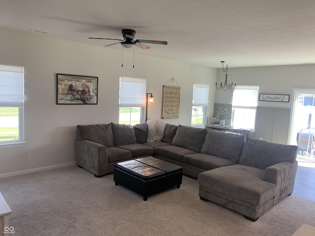 7270 W Stone Pass, New Palestine, IN 46163 - carpeted living room with a chandelier and ceiling fan