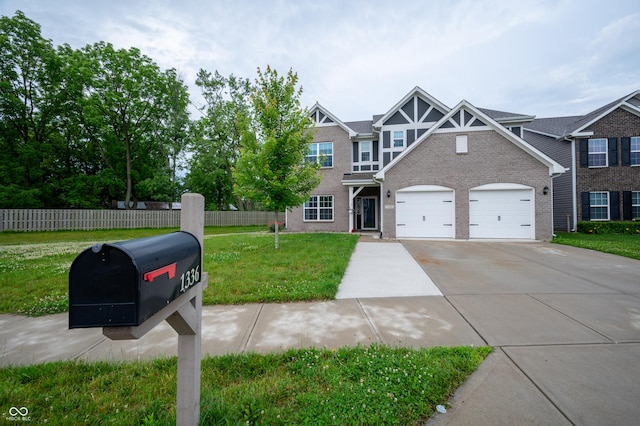1336 Danielle Rd, Lebanon, IN 46052 - view of property featuring driveway, brick siding, and an attached garage