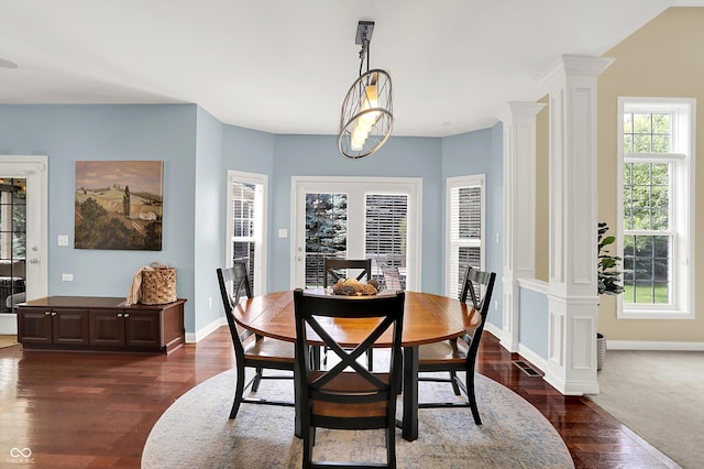10587 Proposal Pointe Way, Fishers, IN 46040 - dining area with dark wood-type flooring, ornate columns, and healthy amount of natural light
