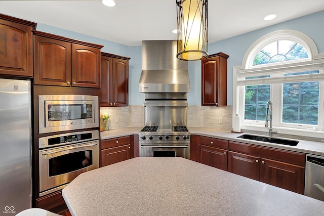 10587 Proposal Pointe Way, Fishers, IN 46040 - kitchen featuring stainless steel appliances, wall chimney exhaust hood, light countertops, backsplash, and recessed lighting