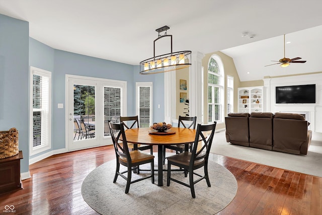 10587 Proposal Pointe Way, Fishers, IN 46040 - dining room featuring hardwood / wood-style flooring, plenty of natural light, vaulted ceiling, ceiling fan, and built in shelves