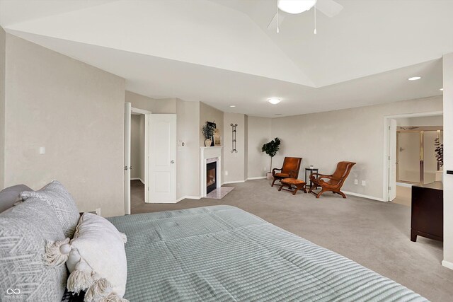10587 Proposal Pointe Way, Fishers, IN 46040 - carpeted bedroom featuring lofted ceiling, a fireplace with flush hearth, recessed lighting, and a ceiling fan