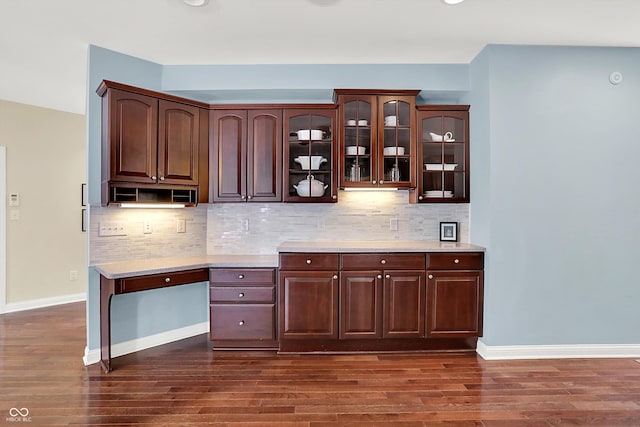 10587 Proposal Pointe Way, Fishers, IN 46040 - kitchen with dark wood-style floors, dark brown cabinets, and glass insert cabinets