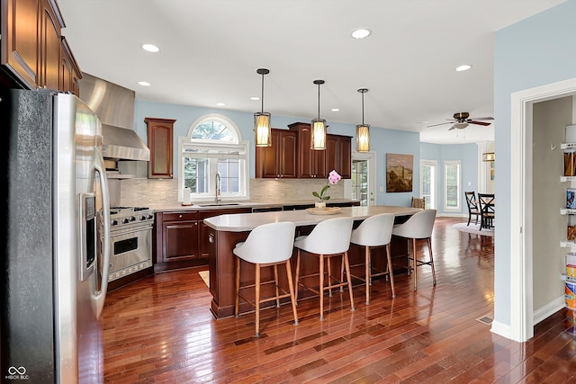 10587 Proposal Pointe Way, Fishers, IN 46040 - kitchen with stainless steel appliances, plenty of natural light, light countertops, a center island, and recessed lighting