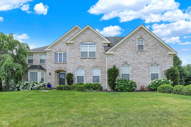 10587 Proposal Pointe Way, Fishers, IN 46040 - view of front of property with a front lawn and brick siding