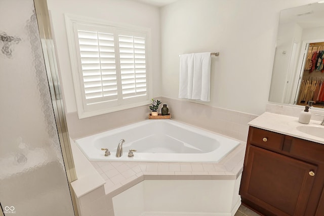 10587 Proposal Pointe Way, Fishers, IN 46040 - bathroom featuring vanity, a bath, and a stall shower