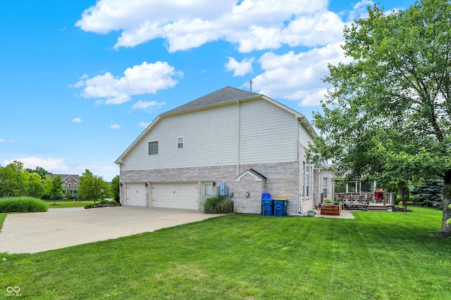 10587 Proposal Pointe Way, Fishers, IN 46040 - view of side of property with an attached garage, a deck, a lawn, brick siding, and driveway