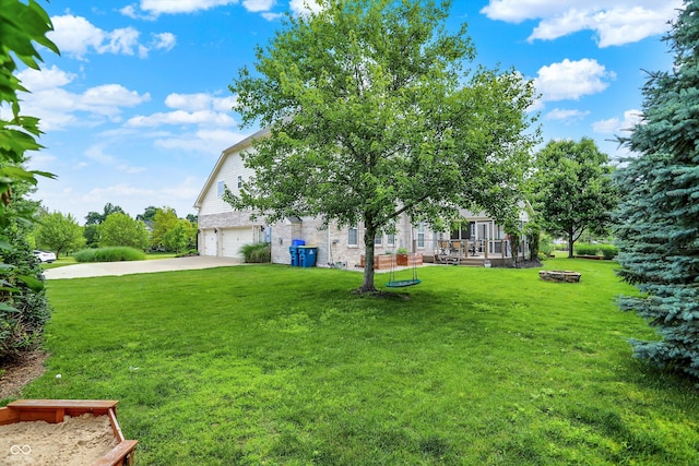 10587 Proposal Pointe Way, Fishers, IN 46040 - view of grassy yard with a garage and driveway