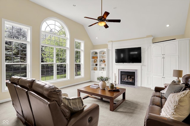 10587 Proposal Pointe Way, Fishers, IN 46040 - living room featuring carpet flooring, a ceiling fan, lofted ceiling, a fireplace with flush hearth, and built in features