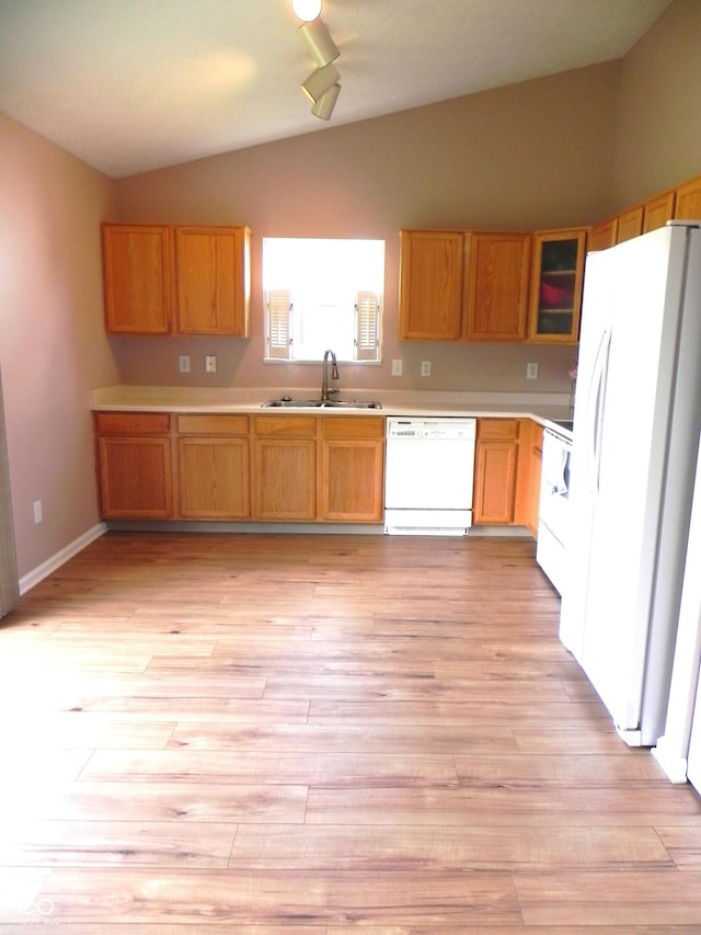 10178 Cornith Way, Avon, IN 46123 - kitchen with white appliances, lofted ceiling, light countertops, light wood-style floors, and glass insert cabinets