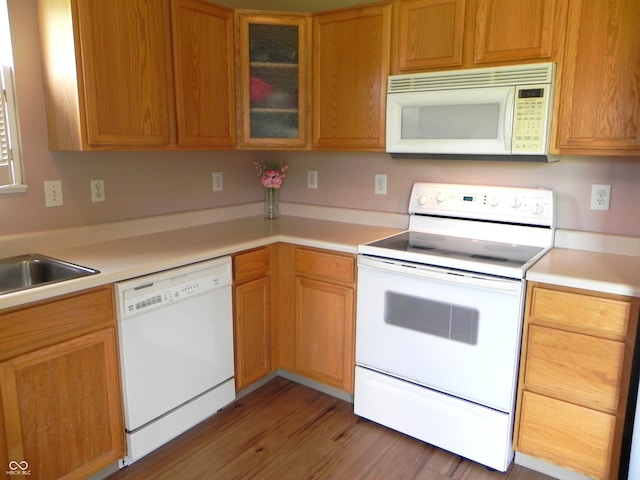 10178 Cornith Way, Avon, IN 46123 - kitchen featuring white appliances, light countertops, glass insert cabinets, and light wood-style floors