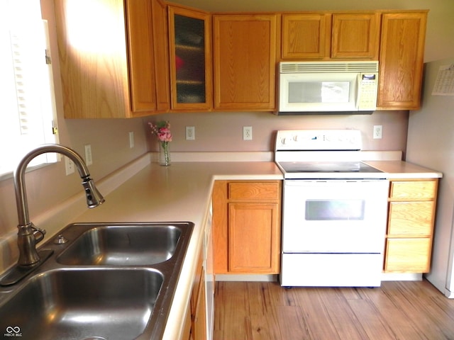 10178 Cornith Way, Avon, IN 46123 - kitchen with white appliances, light countertops, light wood-style flooring, and glass insert cabinets