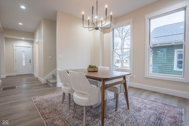 5511 E University Ave, Indianapolis, IN 46219 - dining area with a chandelier, wood finished floors, recessed lighting, and stairs