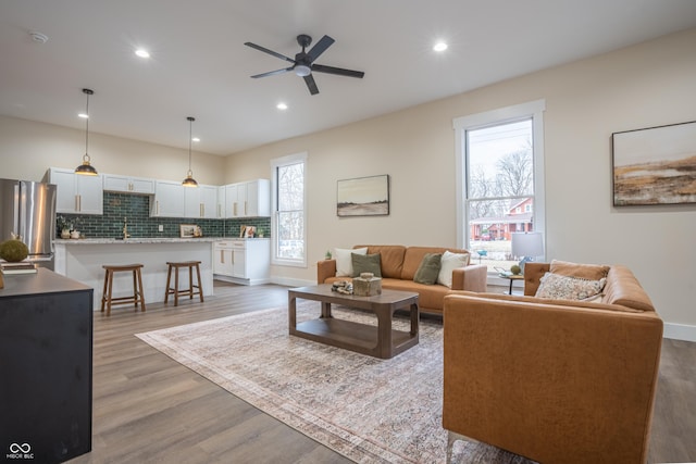5511 E University Ave, Indianapolis, IN 46219 - living room with ceiling fan, wood finished floors, and recessed lighting