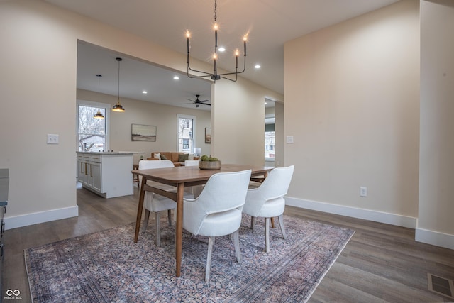 5511 E University Ave, Indianapolis, IN 46219 - dining area with dark wood finished floors, a chandelier, recessed lighting, and a ceiling fan