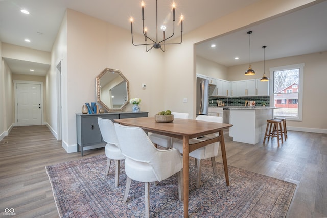 5511 E University Ave, Indianapolis, IN 46219 - dining room featuring wood finished floors, a chandelier, and recessed lighting