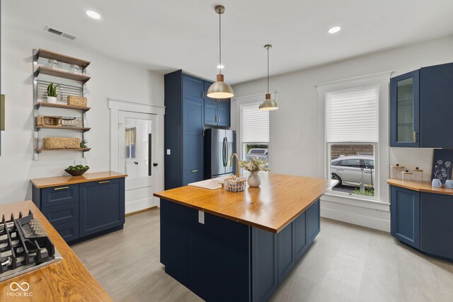 211 N County Line Rd, In, IN 47272 - kitchen with butcher block countertops, blue cabinets, stainless steel appliances, and recessed lighting