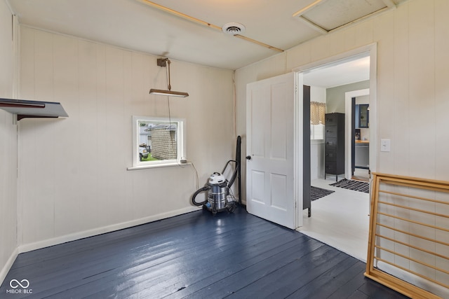 211 N County Line Rd, In, IN 47272 - empty room featuring dark wood-type flooring and attic access