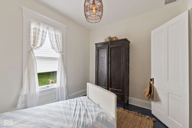 211 N County Line Rd, In, IN 47272 - bedroom featuring baseboards and dark wood-type flooring