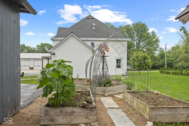 211 N County Line Rd, In, IN 47272 - view of home's exterior featuring a garden, roof with shingles, and a yard