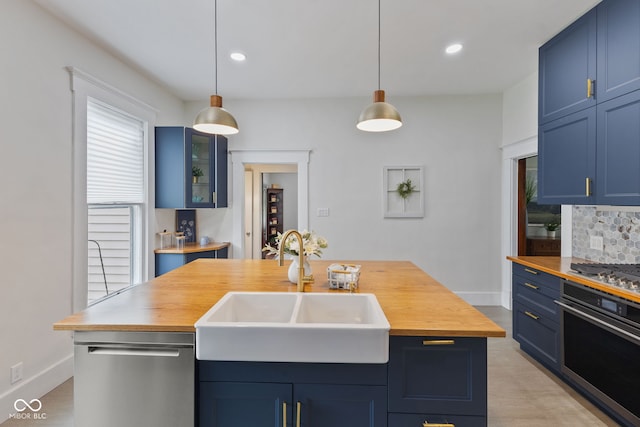 211 N County Line Rd, In, IN 47272 - kitchen featuring appliances with stainless steel finishes, wood counters, blue cabinets, and recessed lighting