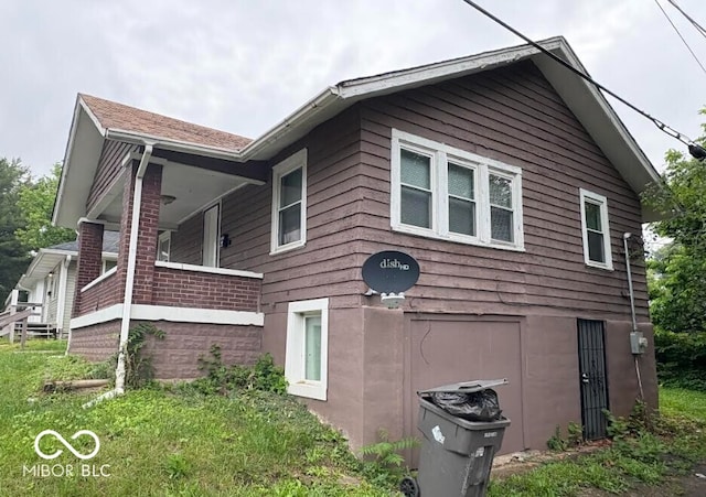 1521 N Tacoma Ave, Indianapolis, IN 46201 - view of property exterior with covered porch