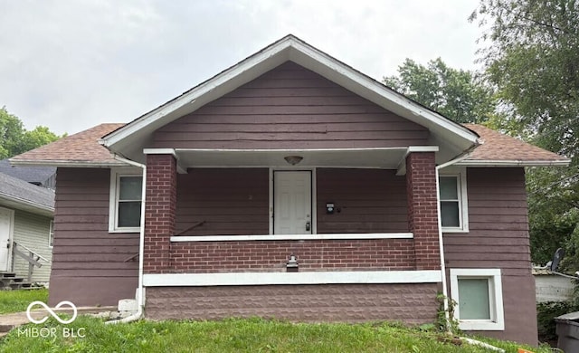 1521 N Tacoma Ave, Indianapolis, IN 46201 - bungalow-style home with brick siding and a shingled roof