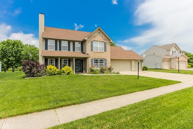 7710 Samuel Dr, Indianapolis, IN 46259 - colonial-style house with driveway, a chimney, a garage, and a front lawn