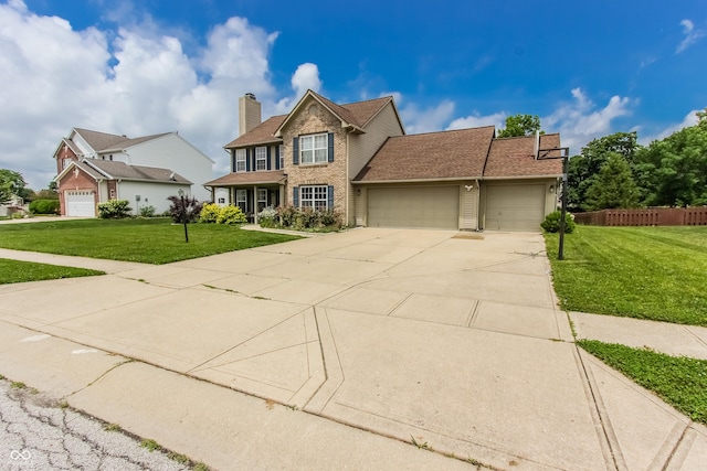 7710 Samuel Dr, Indianapolis, IN 46259 - traditional-style house with a garage, driveway, brick siding, and a chimney