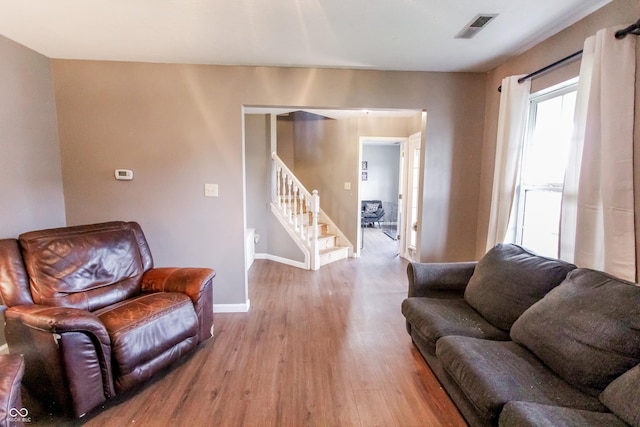 7710 Samuel Dr, Indianapolis, IN 46259 - living area featuring wood finished floors and stairs