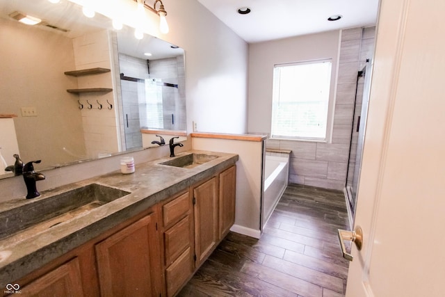 7710 Samuel Dr, Indianapolis, IN 46259 - full bath with a shower stall, a bath, wood finished floors, double vanity, and recessed lighting